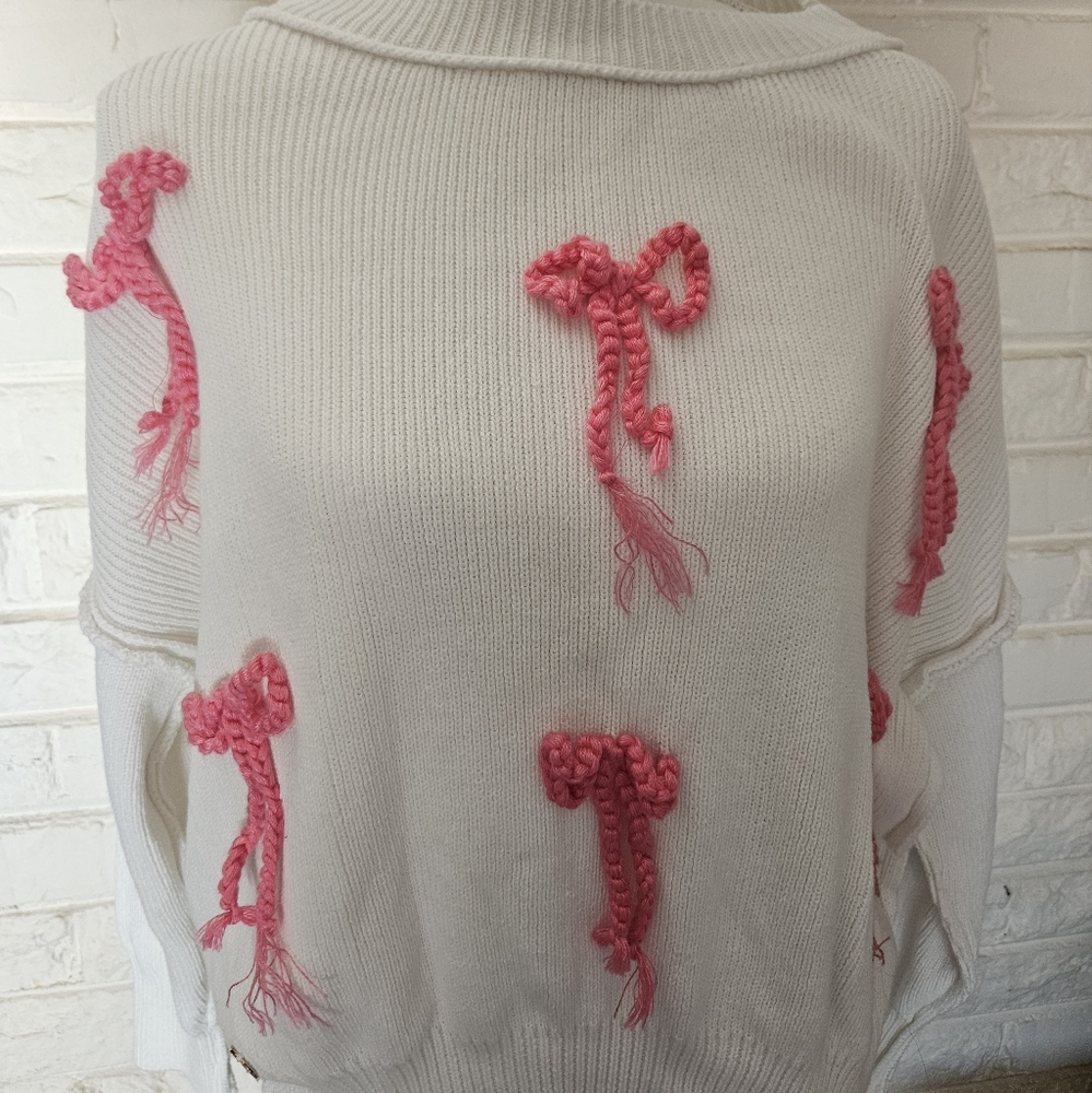 White Sweater with Pink Bow Accents